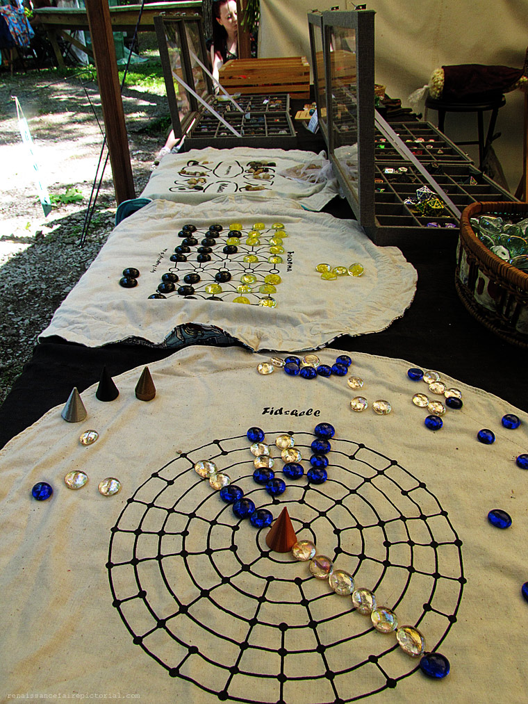 A cloth game board with game pieces.