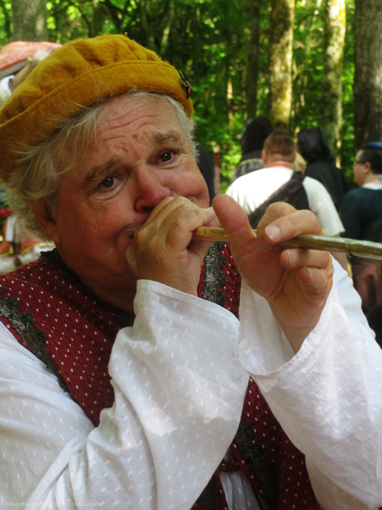 Bob Davanci entertainer blowing a horn.