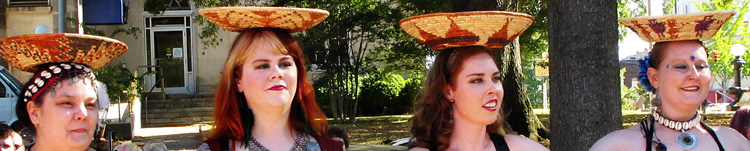 dancers with wicker bowls on thier heads.