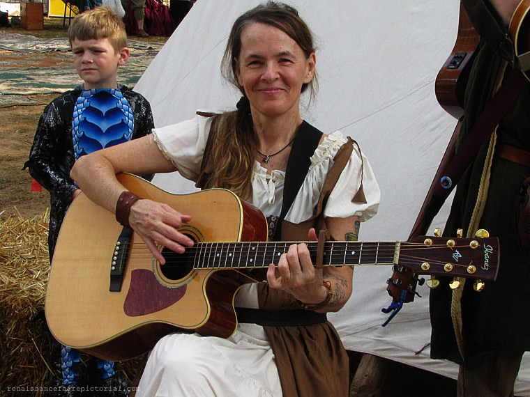 woman playing guitar