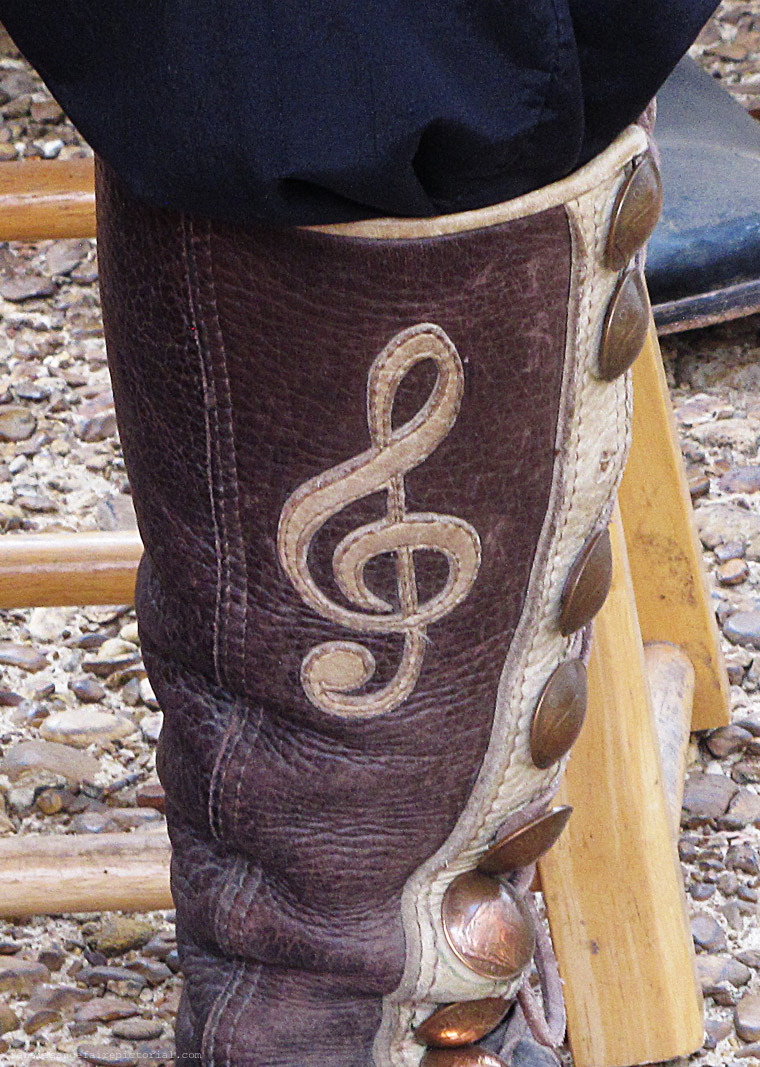 leather boots with a music note symbol