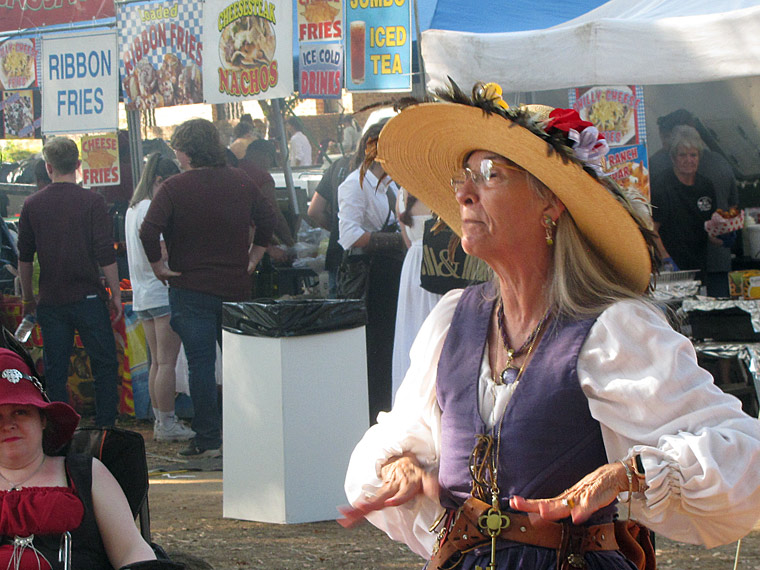 woman singing and gestering with hands.