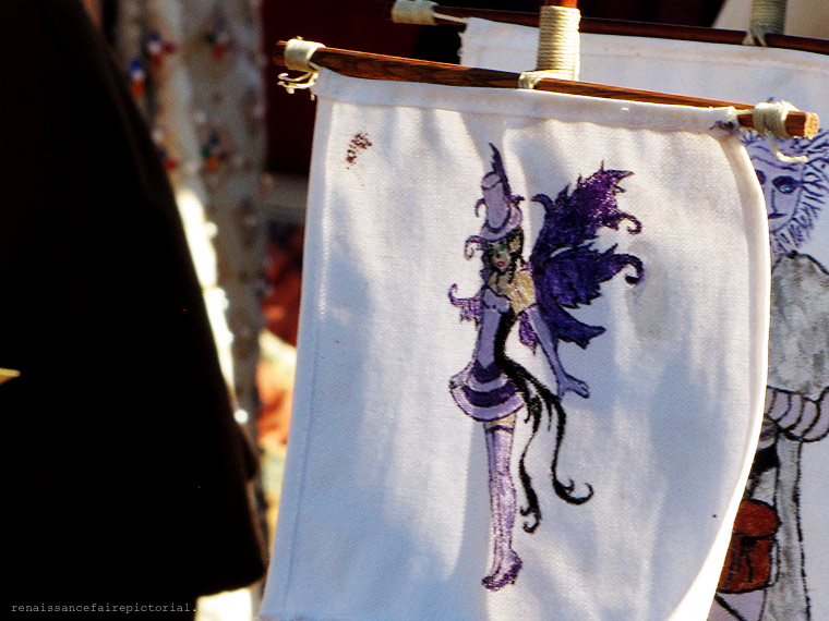 boat sails with handpainted figures of fairy and a troll