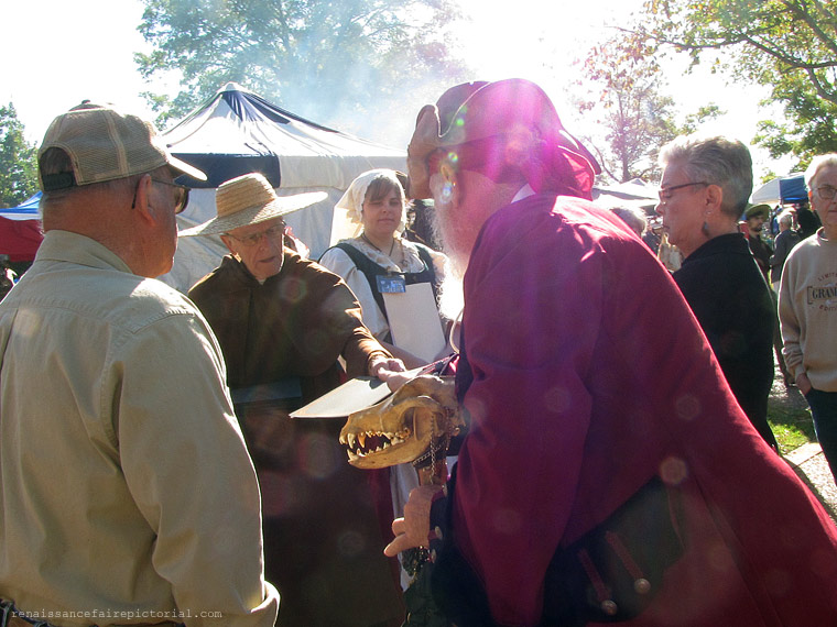 woman adjust her snood,  a white neeting like hair covering.