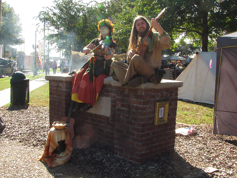 red headed dancer with a blue flower in her hair..