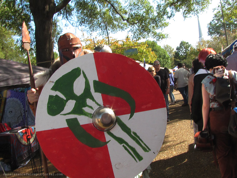 warrior with large sheild. it has a mythosaur skull on it. that the skull boba Fett and Mandalorians wear. 