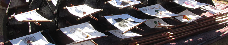 a row of model ships with masts