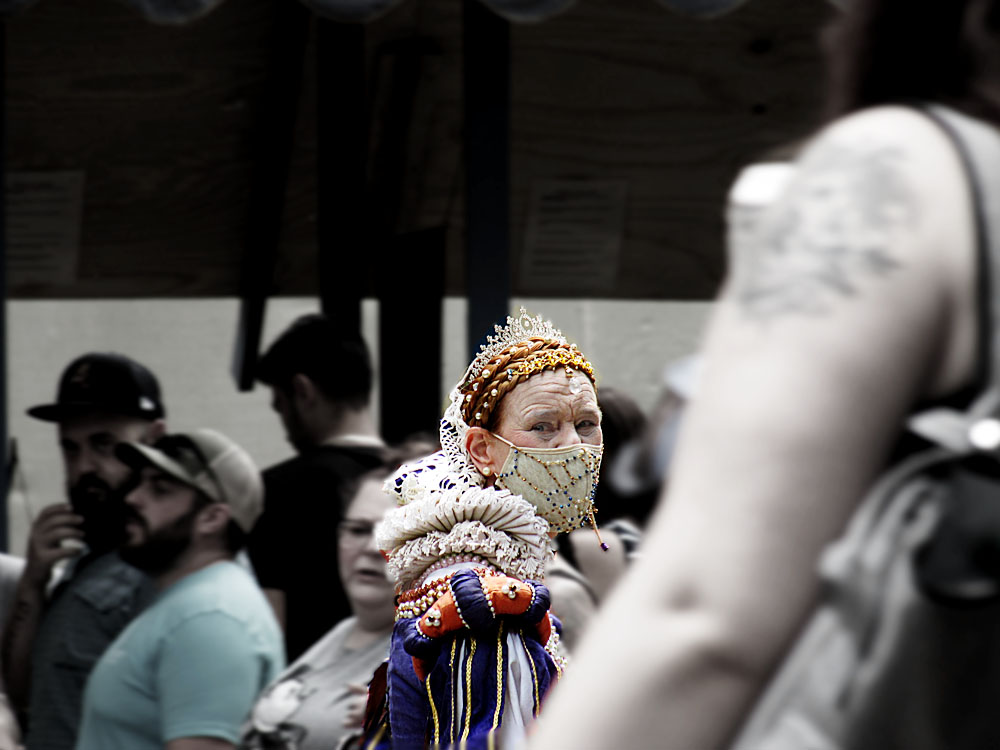 The queen walking through a crowd