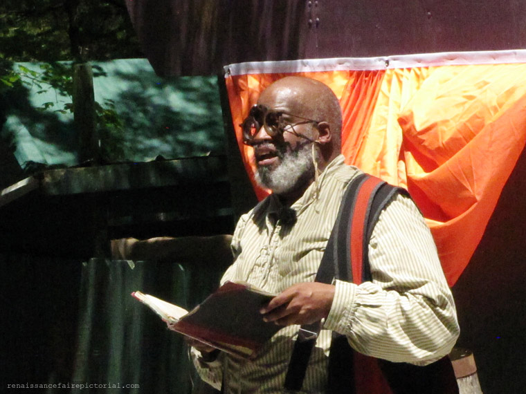 man playing with book