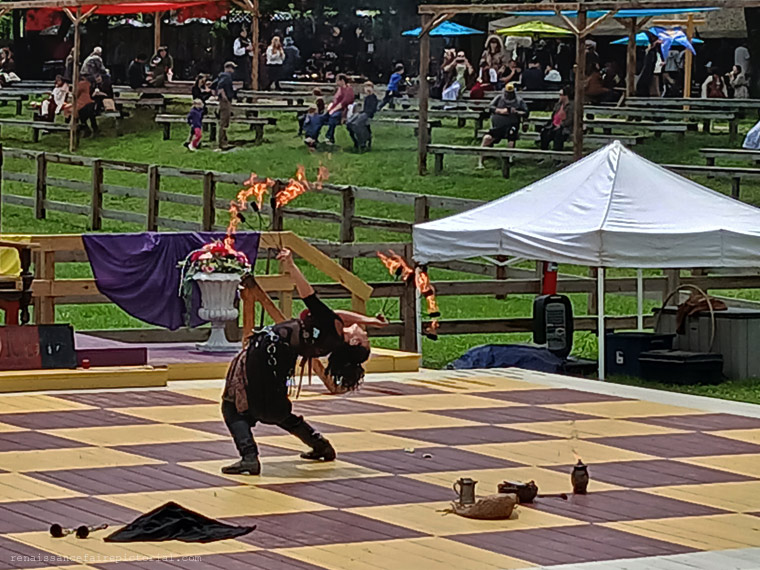woman with flame fans on a chessboard