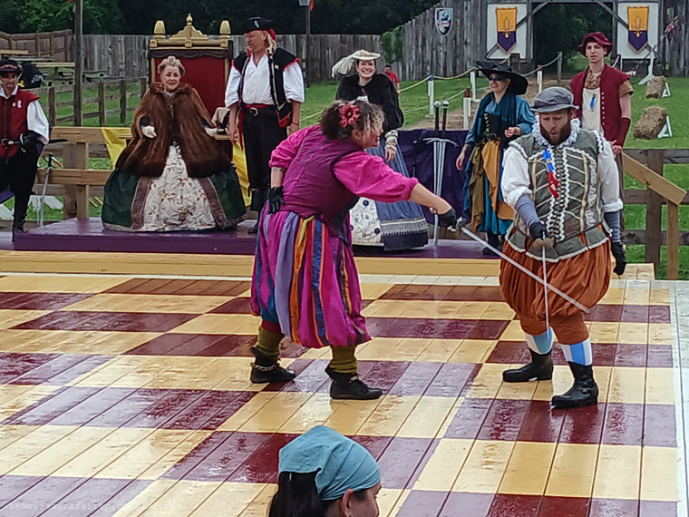 A sword fight on a wooden chessboard.