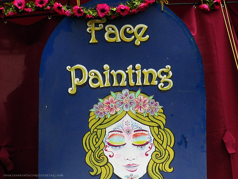 sign that says face painting