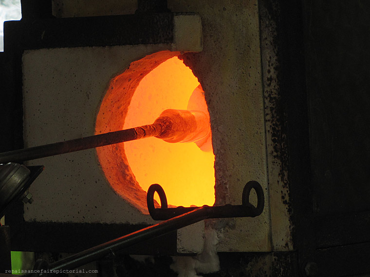 oven for glassmaking. there's a rod in the fire on the tip is red hot glass.