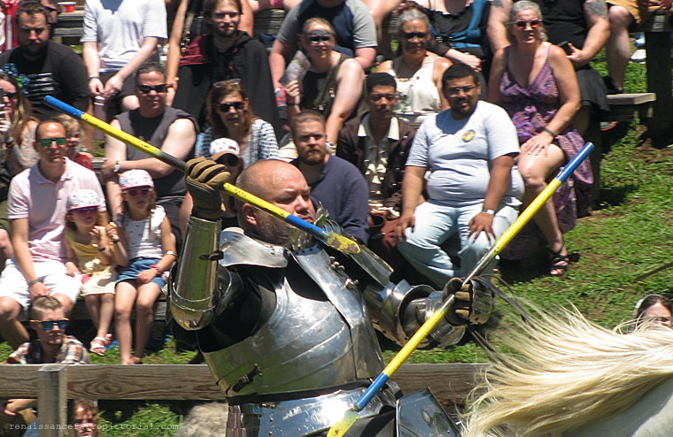 Knight on horseback throwing a spear.