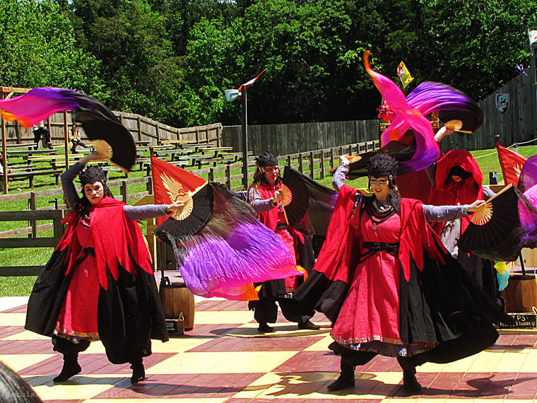 dancers with colorful dancing fans