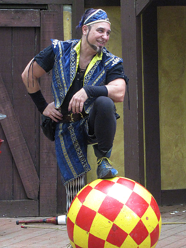 Man posing a a 2 foot diamater ball