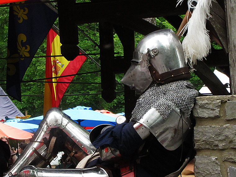 Knight resting on a stone wall.