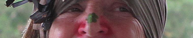 close up of woman's eye and nose. she has a close on her nose.