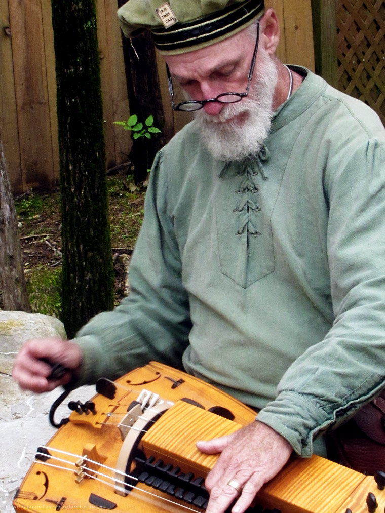 man playing string instrumet in his lap